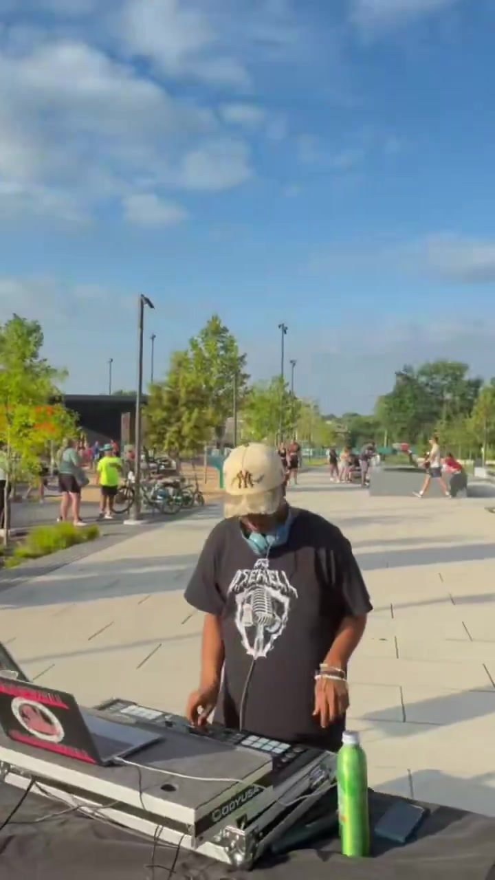DJ D. Sewell at his booth on the street for the Dickson Street Mile race